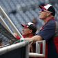 Washington Nationals bench coach Randy Knorr, left, and manager Matt Williams watch batting practice before a baseball game against the Philadelphia Phillies at Nationals Park Thursday, July 31, 2014, in Washington. (AP Photo/Alex Brandon)