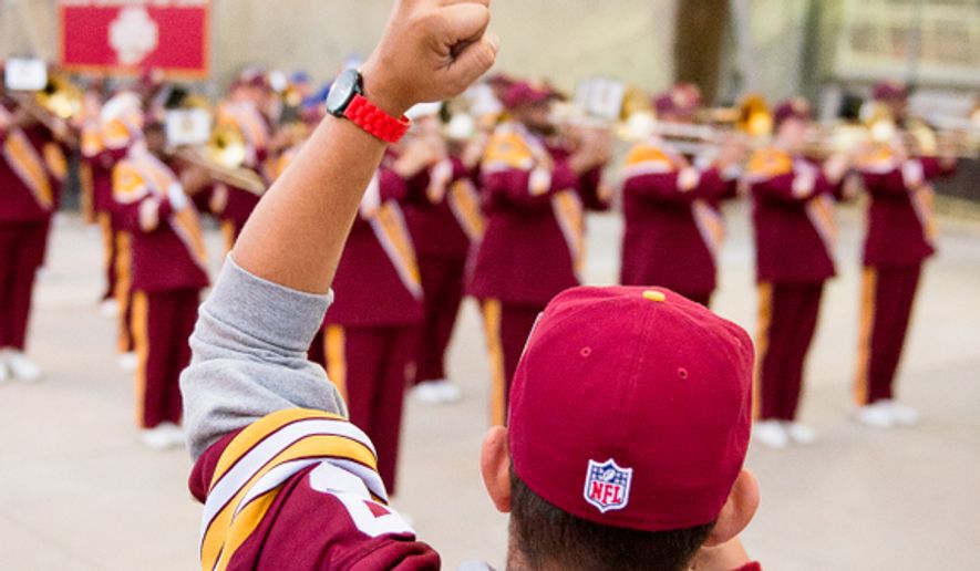 Dave Zelonis of Bowie, Md. cheers for the Redskins marching band outside the stadium before the Washington Redskins play the New York Giants in NFL football at FedExField, Landover, Md., Thursday, September 25, 2014. (Andrew Harnik/The Washington Times)