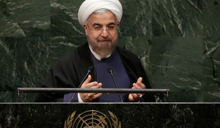 President Hassan Rouhani, of Iran, acknowledges the audience after his address to the 69th session of the United Nations General Assembly, at U.N. headquarters, Thursday, Sept. 25, 2014. (AP Photo/Richard Drew)