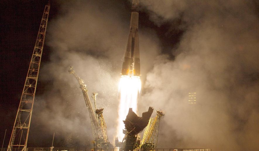 The Soyuz TMA-14M rocket launches from the Baikonur Cosmodrome in Kazakhstan for the International Space Station on Friday, Sept. 26, 2014 carrying NASA astronaut Barry Wilmore and Russians Alexander Samokutyaev and Elena Serova. Serova will become the fourth Russian woman to fly in space and the first Russian woman to live and work on the station. (AP Photo/NASA, Aubrey Gemignani)