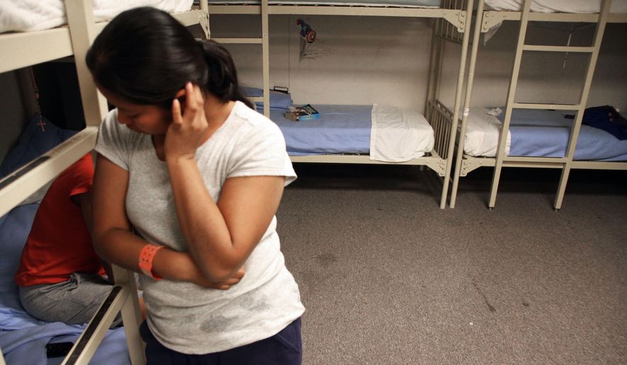 FILE - In this Sept. 10, 2014 file photo, an unidentified Guatemalan woman is seen inside a dormitory in the Artesia Family Residential Center, a federal detention facility for undocumented immigrant mothers and children in Artesia, N.M. More than half of the nearly 60,000 Central America children who have arrived on the U.S.-Mexico border in the past year still don’t have lawyers to represent them in immigration court and many of those who do have volunteer attorneys scrambling to brush up on immigration law. Advocates are holding training sessions to help private sector attorneys learn how to work with traumatized, Spanish-speaking children, many of whom have come fleeing violence. (AP Photo/Juan Carlos Llorca, File)