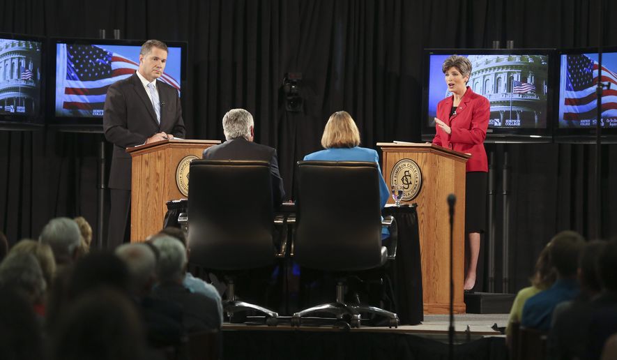 Iowa state Sen. Joni Ernst (right), republican candidate for U.S. Senate, sparred with democratic candidate U.S. Rep. Bruce Braley on Sunday, over immigration and the definition of &quot;amnesty.&quot; The Des Moines Register released a poll over the weekend that showed Mrs. Ernst had opened up a 6-percentage-point lead over Mr. Braley. (Associated Press)