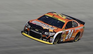 Jeff Gordon drives during practice for the NASCAR Sprint Cup series auto race, Saturday, Sept. 27, 2014, at Dover International Speedway in Dover, Del. (AP Photo/Nick Wass)