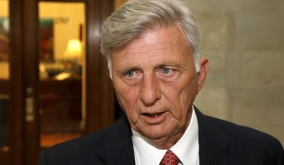 Arkansas Gov. Mike Beebe, a Democrat, hailed the state&#x27;s 2 percent drop in insurance premiums as proof of Obamacare&#x27;s success. (Associated Press)