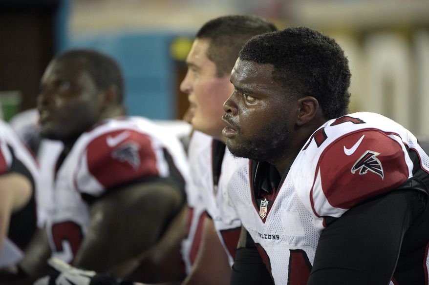 Atlanta Falcons tackle Terren Jones (74) watches from the bench during the second half of an NFL preseason football game against the Jacksonville Jaguars in Jacksonville, Fla., Thursday, Aug. 28, 2014. (AP Photo/Phelan M. Ebenhack)
