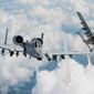 Capts. Andrew Glowa, left, and William Piepenbring launch flares from two A-10C Thunderbolt IIs Aug. 18, 2014, over southern Georgia. Both pilots are with the 74th Fighter Squadron, Moody Air Force Base, Ga. Pilots, maintainers and support Airmen ensure Moody AFB’s A-10s stay mission ready for daily training sorties and deployments downrange. (U.S. Air Force photo by Staff Sgt. Jamal D. Sutter/Released) ** FILE **