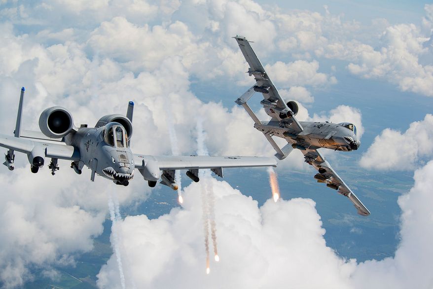 Capts. Andrew Glowa, left, and William Piepenbring launch flares from two A-10C Thunderbolt IIs Aug. 18, 2014, over southern Georgia. Both pilots are with the 74th Fighter Squadron, Moody Air Force Base, Ga. Pilots, maintainers and support Airmen ensure Moody AFB’s A-10s stay mission ready for daily training sorties and deployments downrange. (U.S. Air Force photo by Staff Sgt. Jamal D. Sutter/Released) ** FILE **