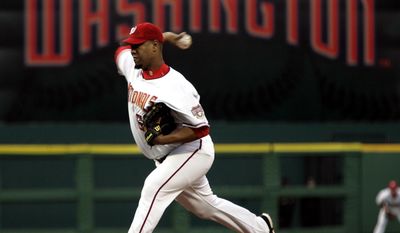 Washington Nationals pitcher Livan Hernandez throws the first pitch of the game against the Arizona Diamondbacks in the Washington Nationals home opener Thursday, April 14, 2005, in Washington. (AP Photo/Evan Vucci)