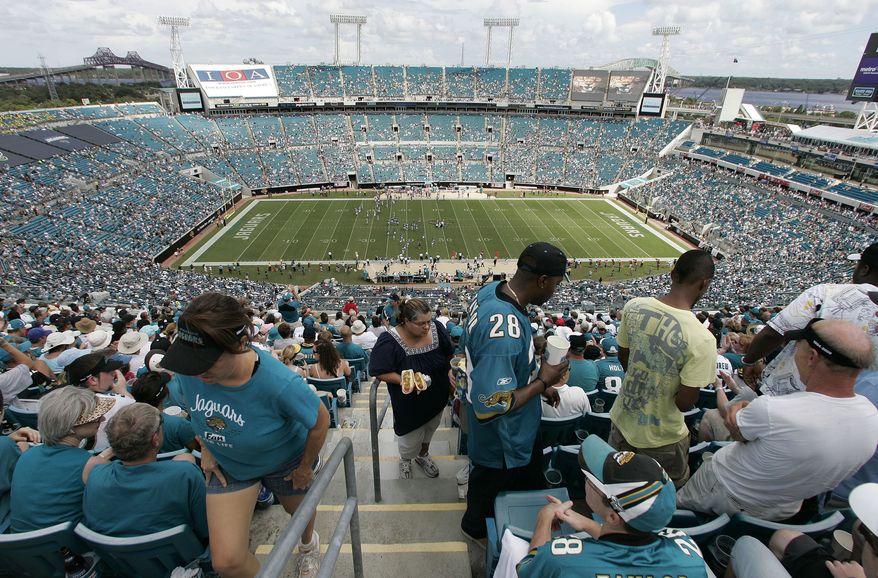 FILE -- This is a Sept. 20, 2009, file photo showing fans in Jacksonville Municipal Stadium stadium during an NFL football game between Arizona Cardinals and the Jacksonville Jaguars, in Jacksonville, Fla. So far, only Jacksonville has had its home opener blacked out last weekend. The Jaguars were so far from selling out that they didn&#x27;t even bother requesting an extension. (AP Photo/Steve Cannon, File)