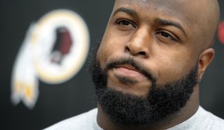 **FILE** Washington Redskin defensive lineman Barry Cofield speaks with reporters during their NFL training camp at Redskins Park in Ashburn, Va., Saturday, July 28, 2012. (AP Photo/Cliff Owen)