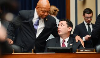 Reps. Elijah Cummings (left), Maryland Democrat, and Jason Chaffetz, Utah Republican, talk Sept. 30 before Secret Service Director Julia Pierson, former Secret Service Director W. Ralph Basham and former Assistant Homeland Security Secretary for Infrastructure Protection Todd Keil testify in front of the House Oversight and Government Reform Committee on Capitol Hill about a recent White House perimeter breach. (Andrew Harnik/The Washington Times)