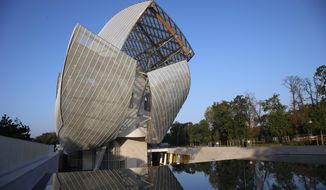 The Louis Vuitton Foundation building is pictured before the presentation of Louis Vuitton&#x27;s Spring/Summer 2015 ready-to-wear fashion collection in Paris, France, Wednesday, Oct. 1, 2014. The foundation, designed by American architect Frank Gehry, will open its doors to the public on Oct. 27 , 2014. (AP Photo/Francois Mori)