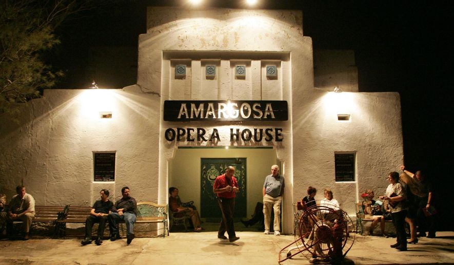 FILE -In this Oct. 1, 2005 file photo, patrons wait for the doors to open at the Amargosa Opera House in Death Valley Junction, Calif., to see a performance. The town once thrived while a local borax mine and railroad were still in operation. By the late 1920s, the town was little more than a tourist stop on the way to the park. Today most of the buildings are gone but the town remains a draw thanks to a hotel and the restored opera house. (AP Photo/The Las Vegas Sun, Sam Morris, File) LAS VEGAS REVIEW-JOURNAL OUT; MAGS OUT; NO SALES; MANDATORY CREDIT