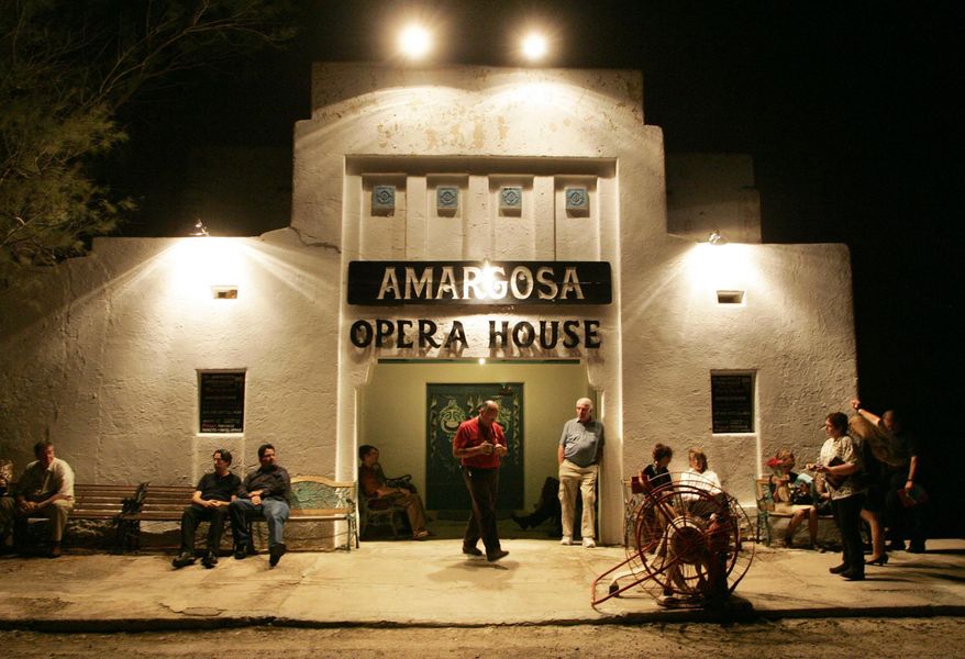 FILE -In this Oct. 1, 2005 file photo, patrons wait for the doors to open at the Amargosa Opera House in Death Valley Junction, Calif., to see a performance. The town once thrived while a local borax mine and railroad were still in operation. By the late 1920s, the town was little more than a tourist stop on the way to the park. Today most of the buildings are gone but the town remains a draw thanks to a hotel and the restored opera house. (AP Photo/The Las Vegas Sun, Sam Morris, File) LAS VEGAS REVIEW-JOURNAL OUT; MAGS OUT; NO SALES; MANDATORY CREDIT