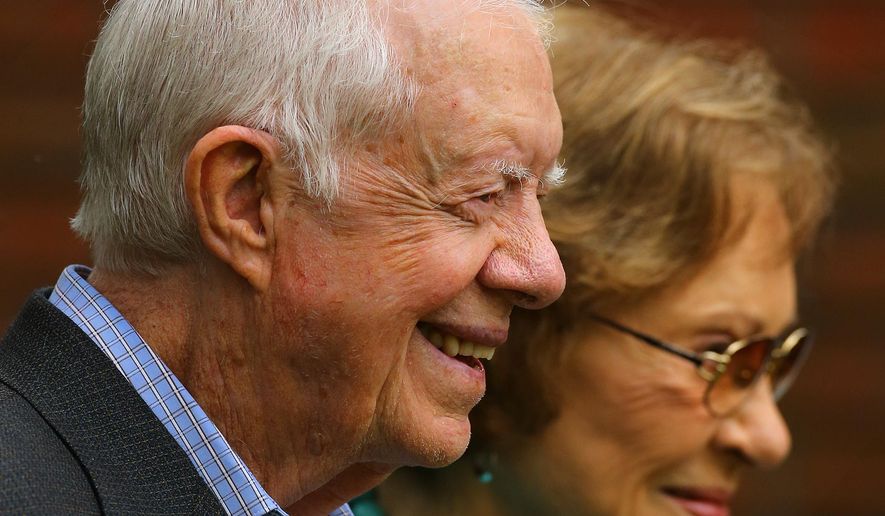 Former President Jimmy Carter and former first lady Rosalynn Carter greet visitors outside the Maranatha Baptist Church after service on Sunday, Sept. 28, 2014, in Plains, Ga. Carter is celebrating his 90th birthday in Atlanta on Wednesday, Oct. 1, 2014. Carter is the second-oldest of the five living U.S. presidents.  (AP Photo/Atlanta Journal-Constitution, Curtis Compton)  MARIETTA DAILY OUT; GWINNETT DAILY POST OUT; LOCAL TELEVISION OUT; WXIA-TV OUT; WGCL-TV OUT