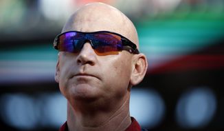 Washington Nationals manager Matt Williams (9) stands during the National Anthem before a baseball game against the Miami Marlins at Nationals Park, Saturday, Sept. 27, 2014, in Washington. (AP Photo/Alex Brandon)