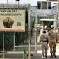 U.S. military guards walk within Camp Delta military-run prison, at the Guantanamo Bay U.S. Naval Base, Cuba, June 27, 2006. (Associated Press) ** FILE **
