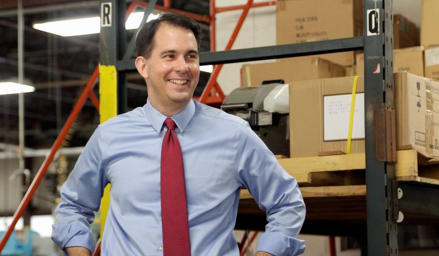incumbent: Republican Wisconsin Gov. Scott Walker is running on his record of bringing business to the state. (Associated Press)