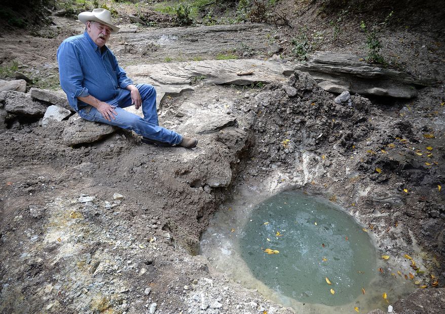 In this Monday, Sept. 22, 2014, photo, Carroll McInroe talks about the mysterious well on his ranch near Stephenville, Texas. McInroe has found artifacts that may date hundreds, if not thousands of years on his ranch outside of Stephenville. (AP Photo/The Fort Worth Star-Telegram, Max Faulkner) MAGS OUT; INTERNET OUT