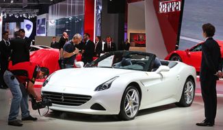 A Ferrari California T is presented at the Paris Motor Show, in Paris, Thursday Oct. 2, 2014. The Paris Motor Show will open its doors to the public on Saturday Oct. 4, until Oct. 19.  European carmakers are hoping to impress with new models at this week&#39;s Paris Motor Show and prove they have come out stronger from years of economic trouble and cost-cutting. (AP Photo/Remy de la Mauviniere)