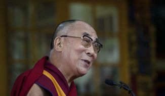 Tibetan spiritual leader the Dalai Lama speaks to a crowd during an event marking 25 years since the leader was awarded the Nobel Peace Prize, in Dharmsala, India, Thursday, Oct. 2, 2014. (AP Photo/Ashwini Bhatia)