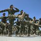Afghanistan National Army soldiers march during their graduation ceremony at the Kabul Military Training Center in Kabul, Afghanistan on June 1, 2014. (Associated Press) ** FILE ** 