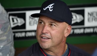 In this Sept. 10, 2014, file photo, Atlanta Braves manager Fredi Gonzalez talks to the media before a baseball game against the Washington Nationals in Washington. Gonzalez will return as the Braves manager next season. Interim general manager John Hart made the announcement Friday, Oct. 3, 2014. (AP Photo/Nick Wass, File)