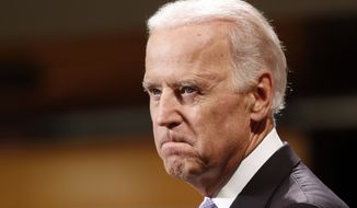 Vice President Joe Biden bites his lip while speaking to students faculty and staff at Harvard University&#39;s Kennedy School of Government in Cambridge, Mass. Thursday, Oct. 2, 2014. (AP Photo/Winslow Townson)