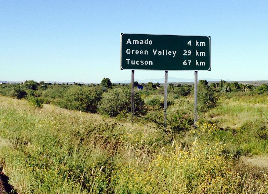 This Tuesday, Sept. 30, 2014 photo shows a sign on northbound Interstate 19, near Amado, Ariz., in the southern part of the state, that tells drivers they are kilometers away from their destination. Although other highways around the country have some metric signs, I-19 is the only continuous highway that is entirely in the metric system. The signs were installed nearly 40 years ago as part of pilot program that aimed to introduce the use of the metric system in the United States. (AP Photo/Astrid Galvan)