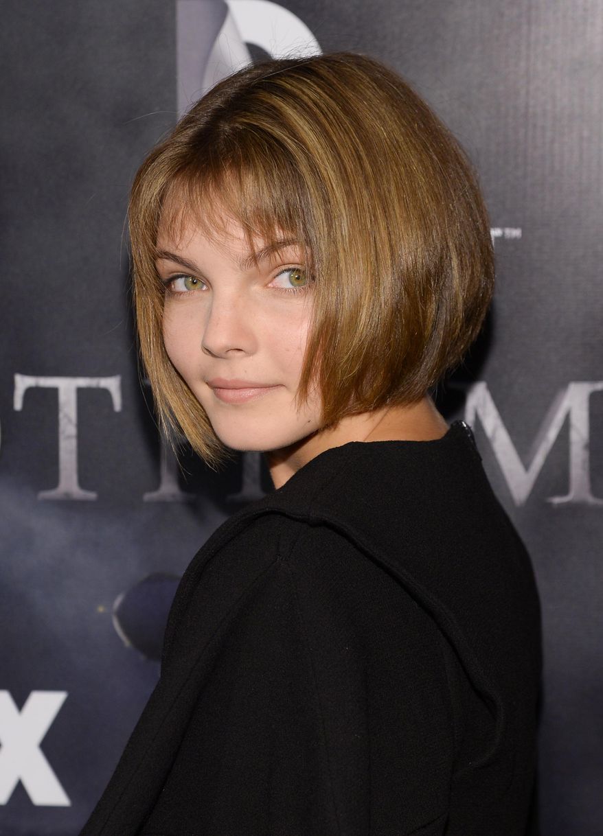 FILE - In this Monday, Sept. 15, 2014 file photo, actress Camren Bicondova attends the "Gotham" series premiere event at the New York Public Library, in New York. If you want an executive producer to cast you as the next Catwoman and you're not sure of your feline sensibilities, then it's best to consult a cat. Bicondova watched her own cat, Mr. G, and landed the role of Selina Kyle — aka Catwoman — on "Gotham," the new Batman-inspired TV series from Fox. (Photo by Evan Agostini/Invision/AP, file)