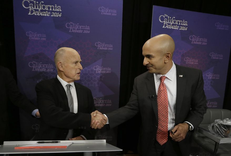FILE--In this Sept. 4, 2014 file photo, Gov. Jerry Brown, left, shakes hands with Republican challenger Neel Kashkari before a gubernatorial debate in Sacramento, Calif., Thursday, Sept. 4, 2014.(AP Photo/Rich Pedroncelli, file)