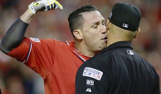 Washington Nationals&#39; Asdrubal Cabrera argues his strike out call with home plate umpire Vic Carapazza in the tenth inning of Game 2 of baseball&#39;s NL Division Series against the San Francisco Giants at Nationals Park, Saturday, Oct. 4, 2014, in Washington. Cabrera was ejected from the game. (AP Photo/Mark Tenally)