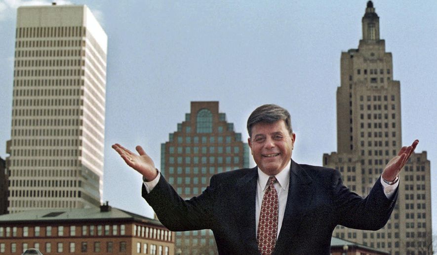 FILE - In this October 1998 file photo, Mayor Vincent "Buddy" Cianci Jr., poses along in front of the city's skyline in Providence, R.I. Cianci, who served a total of 21 years as mayor, was twice driven from office due to felony convictions. He is making another comeback bid in the Nov. 4, 2014 election. (AP Photo/Matt York, File)