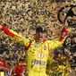 NASCAR Sprint Cup Series driver Joey Logano celebrates his victory in the Hollywood Casino 400 at Kansas Speedway in Kansas City, Kan., Sunday, Oct. 5, 2014. (AP Photo/Colin E. Braley)