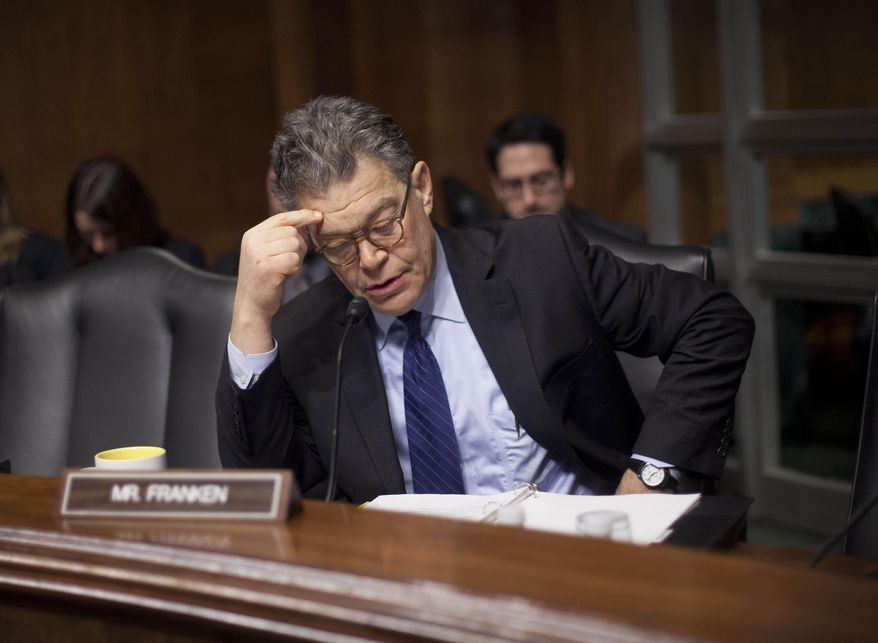 FILE - In this Feb. 4, 2014 file photo, Senate Judiciary Committee member Sen. Al Franken, D-Minn., reads over his notes before the start of a hearing on data breaches and combating cybercrime on Capitol Hill in Washington. “We now have this incredible acceleration of information technology and there are privacy issues that are both sort of Constitutional issues, but also commercial issues,” Franken said in an interview with The Associated Press on Friday, Oct. 3, 2014. (AP Photo/Pablo Martinez Monsivais, File)