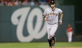 San Francisco Giants&#39; Brandon Belt runs the bases after hitting a solo home run in the 18th inning of Game 2 of baseball&#39;s NL Division Series against the Washington Nationals in Nationals Park, Saturday, Oct. 4, 2014, in Washington. (AP Photo/Patrick Semansky)