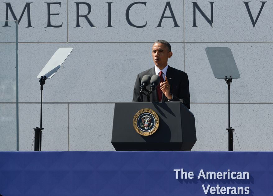 U.S. President Barack Obama speaks during the dedication ceremony for the American Veterans Disabled for Life Memorial in Washington, Sunday, Oct. 5, 2014. (AP Photo/Molly Riley)