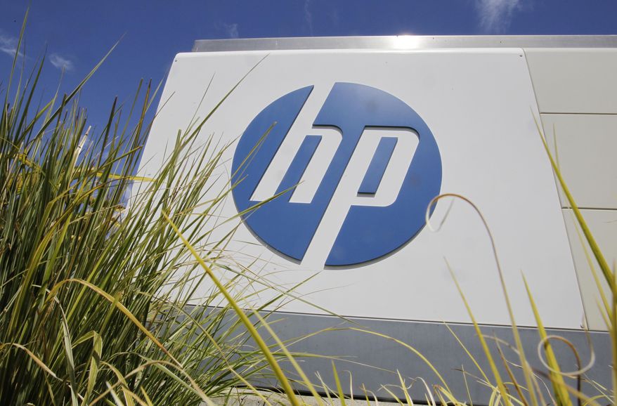 In this Aug. 21, 2012, file photo, the Hewlett-Packard Co. logo is seen outside the company's headquarters in Palo Alto, Calif. Hewlett-Packard Co. is splitting itself into two companies, one focused on its personal computer and printing business and another on technology services, such as data storage, servers and software, as it aims to drive stronger profitability. (AP Photo/Paul Sakuma, File)