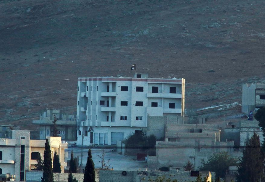 Kobani, also known as Ayn Arab, has been under attack since mid-September, with militants capturing dozens of nearby Syrian Kurdish villages. The Islamic State flag indicates the jihadi may have regrouped and broken through Kurdish defense lines. (associated press)