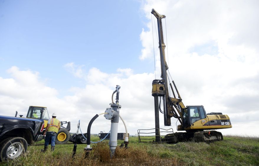 In a Wednesday, Oct. 1, 2014 photo, Sean Slayton of Quality Drilling Service drills a new well to collect landfill gas at the Sioux Falls Sanitary Landfill near Hartford. Approximately 150 wells collect gas which is piped to the Poet ethanol plant near Chancellor. The Sioux Falls Regional Landfill, which serves five counties, has been collecting methane since 2009. Proposed federal rules could require upgrades to the landfill's system and might jeopardize a financial incentive it collects for voluntarily reducing emissions, Landfill Superintendent Dave McElroy told the Argus Leader newspaper. (AP Photo/Argus Leader, Elisha Page)
