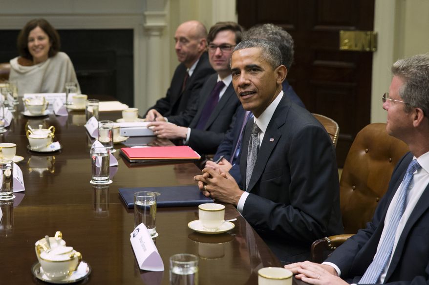 President Obama meets with financial regulators for a discussion on the economy and to receive an update on implementation of Wall Street Reform on Monday, Oct. 6, 2014, in the Roosevelt Room of the White House in Washington. (AP Photo/Evan Vucci)