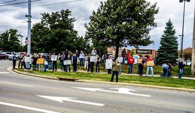 About 40 gun-toting demonstrators gathered in front of the Beavercreek, Ohio, Walmart to protest the Aug. 5 police shooting of 22-year-old John Crawford III. (Twitter/@guncultureworld)