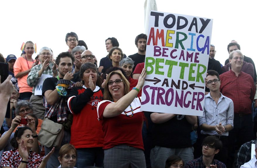 People gather during a gay marriage rally Monday, Oct. 6, 2014, in Salt Lake City. Same-sex couples in Utah were celebrating after the U.S. Supreme Court on Monday cleared the way for gay marriages to begin in this state and 30 others. The high court on Monday rejected an appeal from Utah and four other states that had sought to bar weddings between gay couples. (AP Photo/Rick Bowmer)