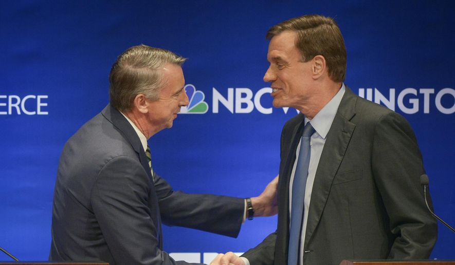 The candidates shake hands before the Fairfax County Chamber of Commerce hosts Virginia&#x27;s U.S. Senate Debate between Democratic U.S. Sen. Mark Warner, right, and Republican challenger Ed Gillespie on Tuesday, Oct. 7, 2014 in McLean, Va. (AP Photo/The Washington Post, Bill O&#x27;Leary, Pool)