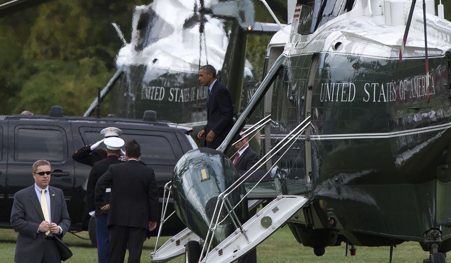 President Barack Obama walks off Marine One after arriving for a fundraiser, on Tuesday, Oct. 7, 2014, in Greenwich, Conn. Obama is traveling to New York and Connecticut for Democratic fundraisers. (AP Photo/Evan Vucci)