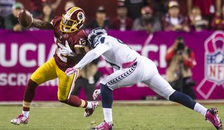 Washington Redskins wide receiver Andre Roberts (12) turns upfield for a first down reception against the Seattle Seahawks at FedExField, Landover, Md., Oct. 6, 2014. (Preston Keres/Special for The Washington Times)