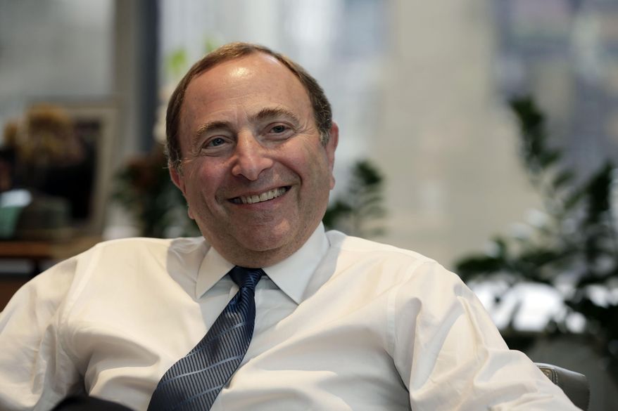 National Hockey League Commissioner Gary Bettman is interviewed in his office, in New York, Tuesday, Oct. 7, 2014. Bettman is flattered that North American cities without hockey teams are interested in adding one to their towns, but it just isn't in the plans Bettman said Tuesday Oct. 7, 2014 during an interview with The Associated Press. (AP Photo/Richard Drew)