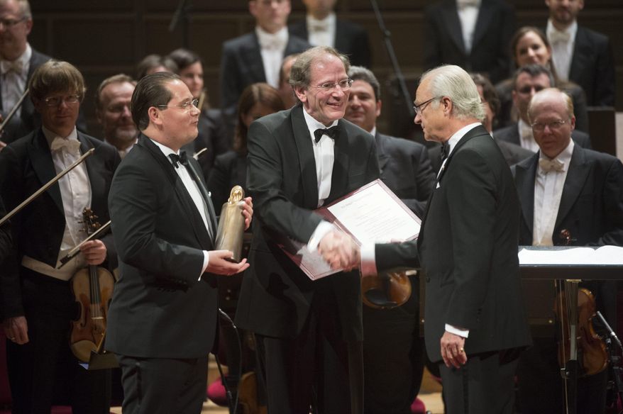 Andreas Grossbauer, left, of the Vienna Philharmonic Orchestra, and his precursor as chairman and present archivist, Clemens Hellsberg, center, shakes hands with Swedish King Carl XVI Gustaf at the Concert Hall in Stockholm, Sweden, Wednesday Oct. 8, 2014, during a ceremony in memory of legendary soprano Birgit Nilsson. The Vienna Philharmonic Orchestra has been awarded the Birgit Nilsson Dollars 1 million Prize for 2014. (AP Photo/TT News Agency, Fredrik Sandberg) SWEDEN OUT