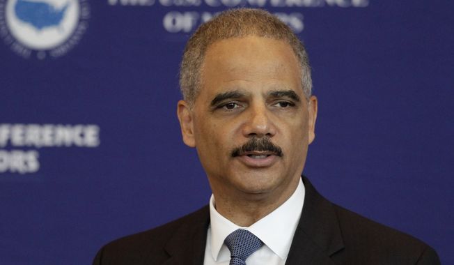 U.S. Attorney General Eric Holder speaks to a meeting of the U.S. Conference of Mayors at the Clinton Presidential Library in Little Rock, Ark., on Oct. 8, 2014. (Associated Press) **FILE**