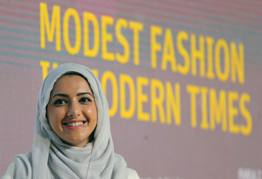 In this Oct. 5, 2014 photo, Summer Albarcha, owner of photo-sharing Instagram account "Hipster Hijabis", talks during a Fashion Forward session in Dubai, United Arab Emirates. By fusing both their sense of fashion with their faith, Muslim women are reinterpreting traditional notions of what it means to dress conservatively. Some have also pioneered businesses around this growing demand, finding unexpected supporters among some mainstream brands, as well as conservative Christian and Orthodox Jewish women. (AP Photo/Kamran Jebreili)